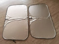 Titanium silver aluminium foil car sunshade laid flat, showing its reflective solid colour surface.