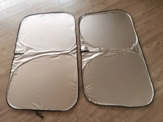 Titanium silver aluminium foil car sunshade laid flat, showing its reflective solid colour surface.