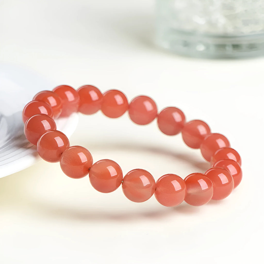 Natural South Red Cherry Red Agate bead bracelet shown in single and three-strand styles.