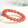 Natural South Red Cherry Red Agate bead bracelet shown in single and three-strand styles.