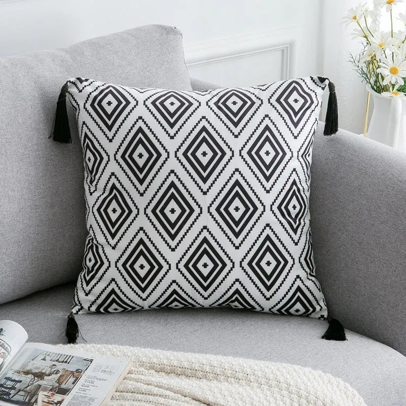 Bohemian style throw pillow on a sofa, available in light grey, black, or white, shown in 45x45cm size.