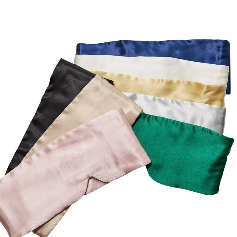 Mulberry silk sleep eye mask in multiple colours including black, gold, green, blue, pink, grey, and white.