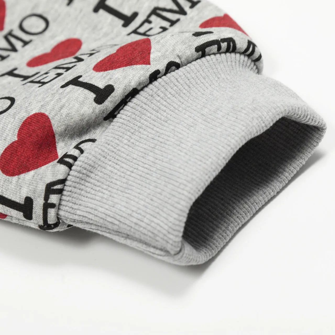 Women's grey hooded cardigan with a colourful autumn-themed retro pattern print on the front.