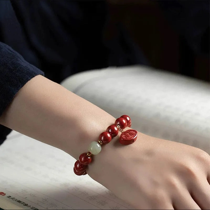Natural cinnabar bracelet with emperor sandstone Ping An Fu Lu design in 8mm and 10mm sizes