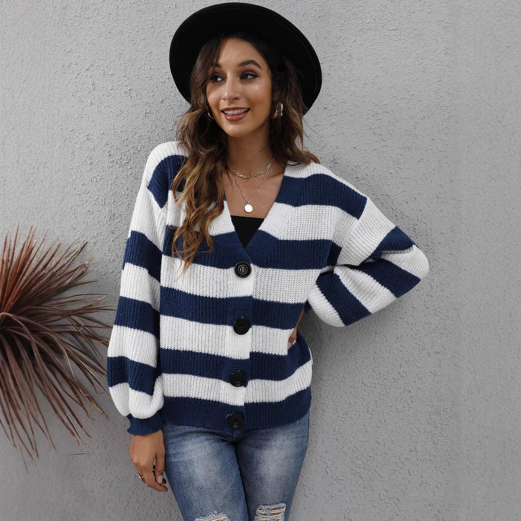 Women's blue striped deer plush polyester cardigan with buttons on a hanger.