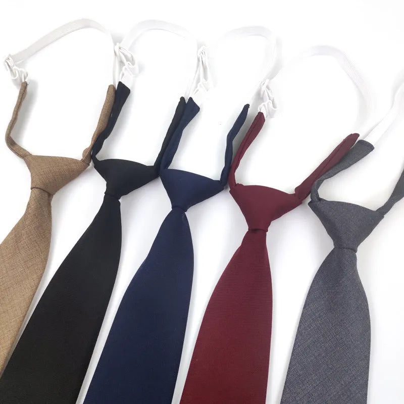 Men's navy blue cotton bow tie with arrow style on a plain background.