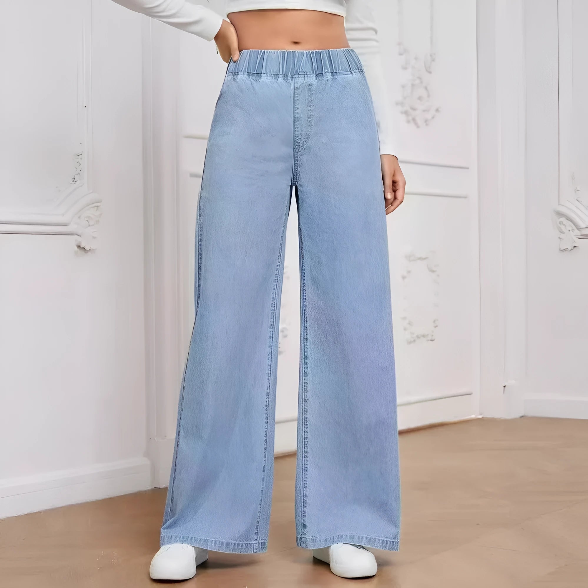 Light blue washed wide-leg jeans with straight leg cut and zip fly