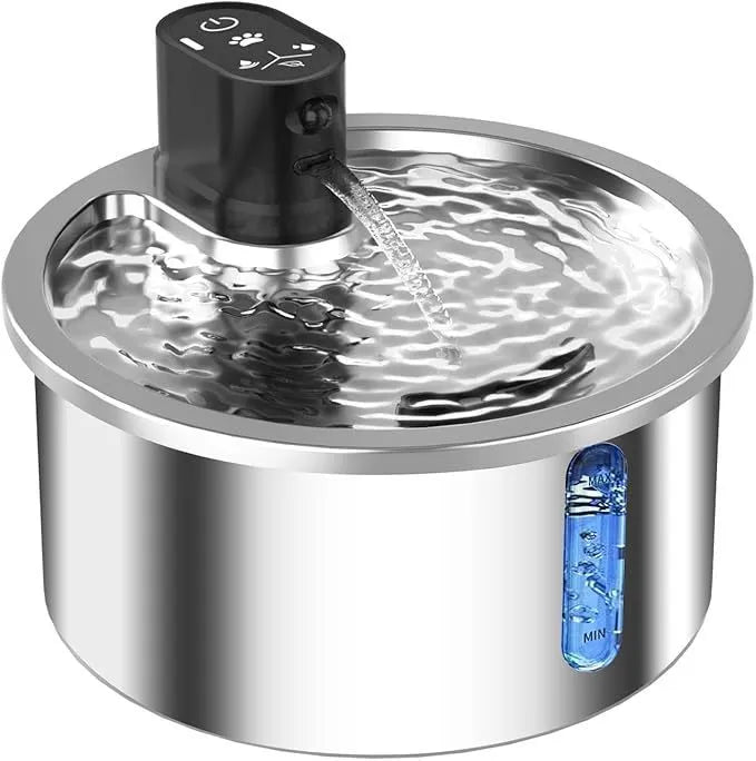 Stainless steel heated pet water fountain with charging cable on a white base.