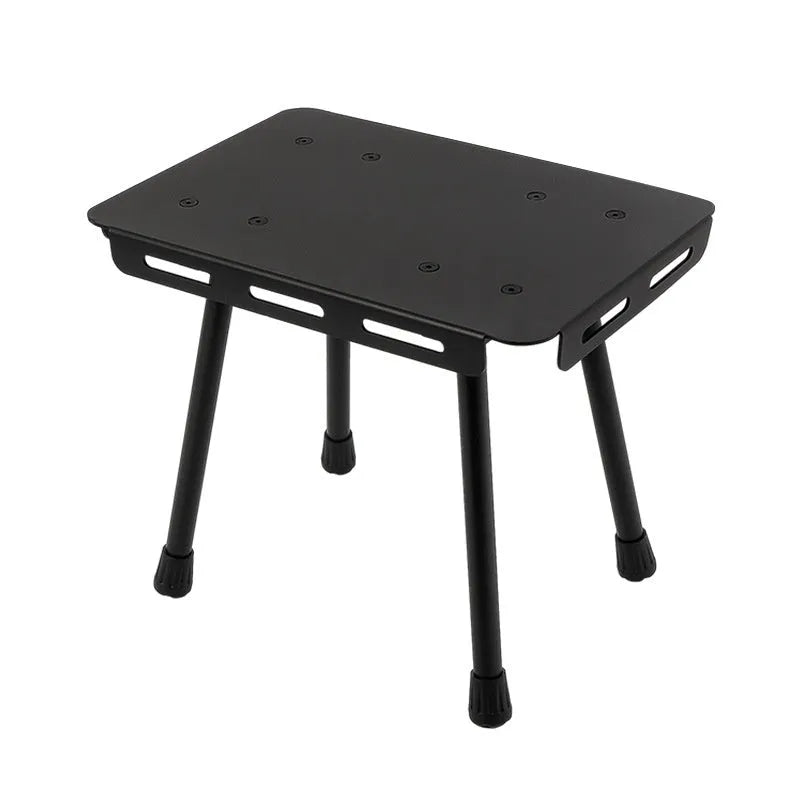 CLS aluminium alloy dual-use folding camping table shown converted into a stool with a green PU mat cushion.
