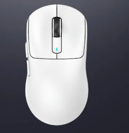 Black rechargeable computer mouse with three-mode connectivity on a desk next to a laptop.