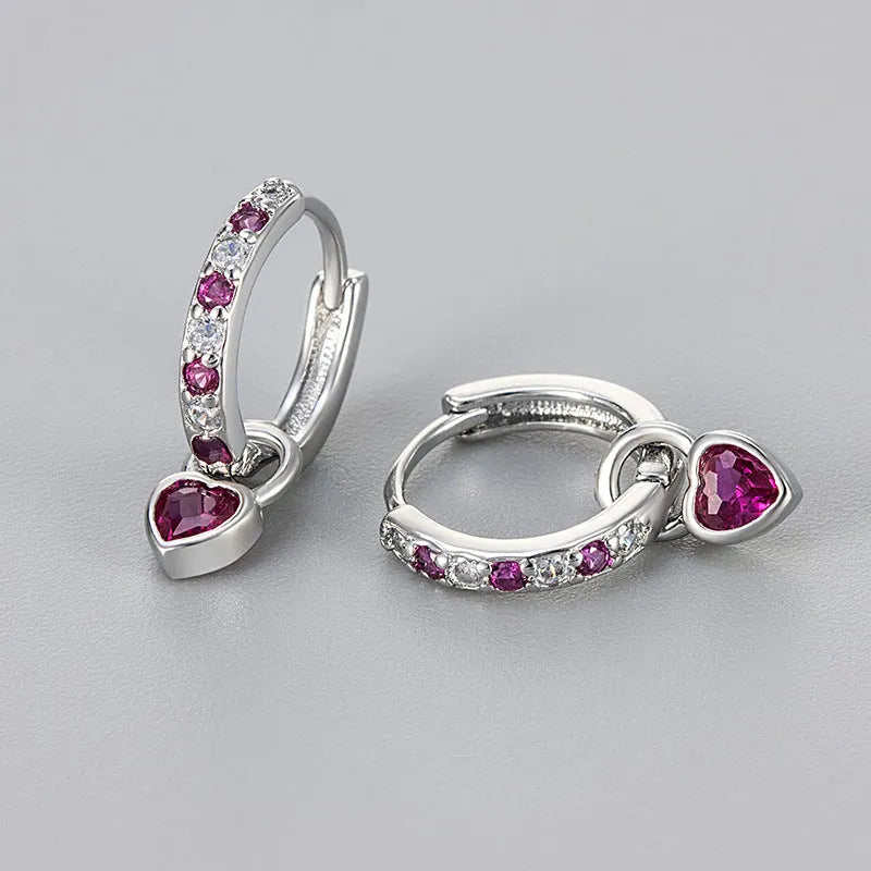 Women's zircon earrings with heart-shaped drops in gold or white gold settings with coloured gemstones