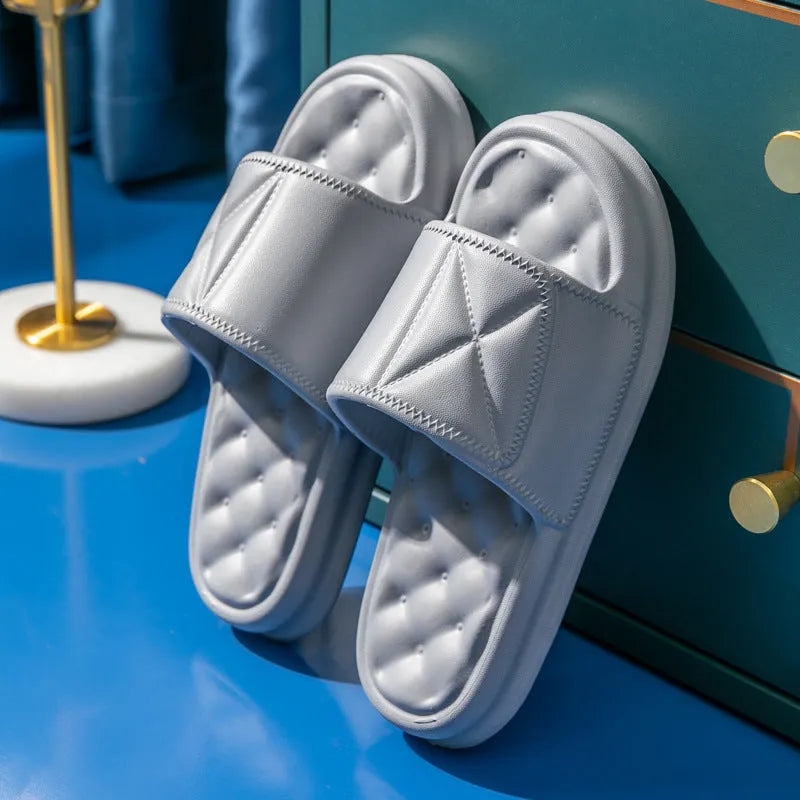A pair of soft EVA bathroom slippers with a thick non-slip sole, shown in available colours.