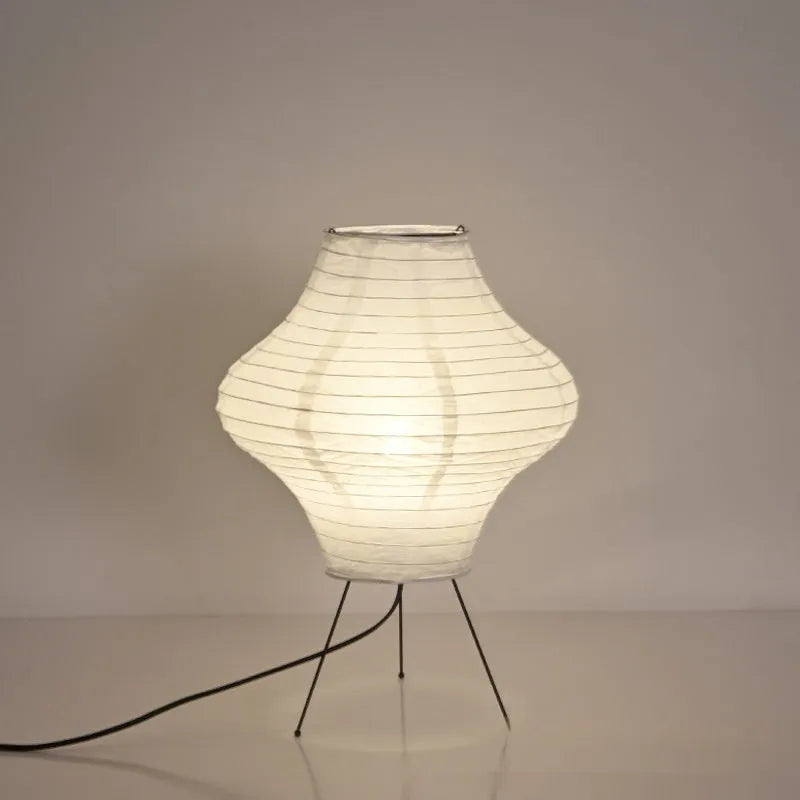 Japanese style decorative table lamp with a white Xuan paper shade on a wooden base.
