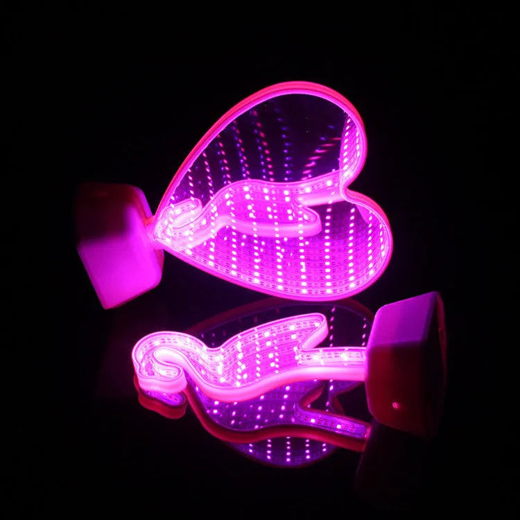 Rose red LED double-sided love tunnel light on a tabletop showing its plastic construction and dimensions.