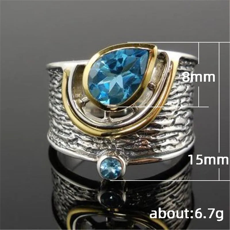 Blue zircon inlaid women's ring with Chinese style design and drop shape on alloy band