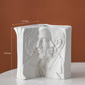 Glazed ceramic book stand in modern simplicity style on a desktop.