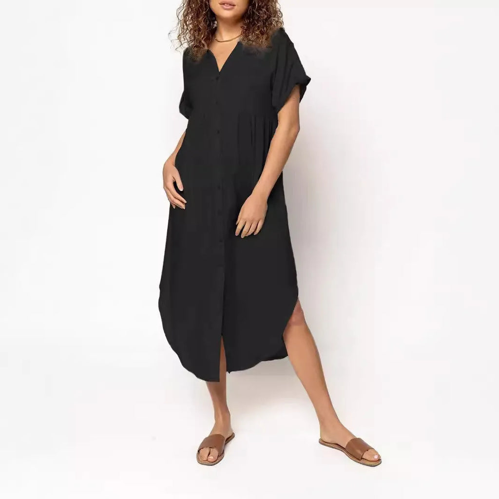 Loose-fitting casual solid colour button dress in a mid-length style on a hanger.