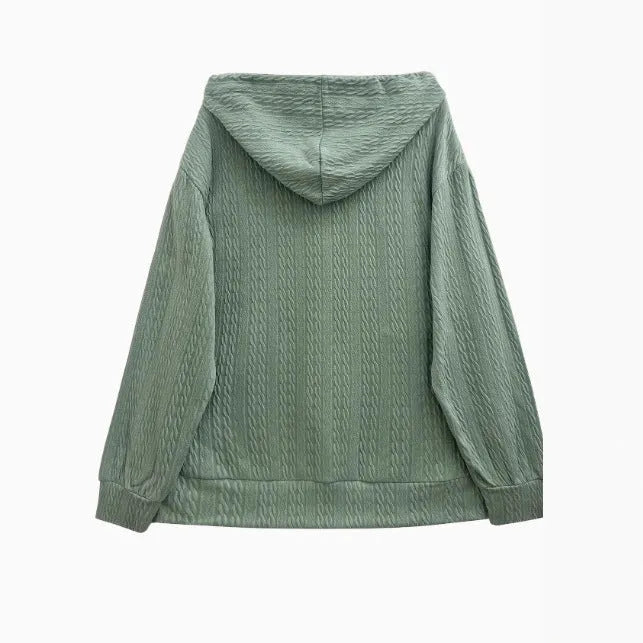 Green women's hooded zip-up sweater coat with long sleeves on a hanger.