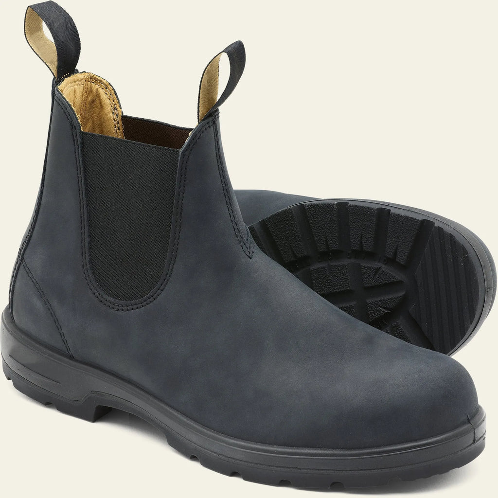 Vintage frosted brown PU leather Chelsea boots for men and women on a wooden surface.