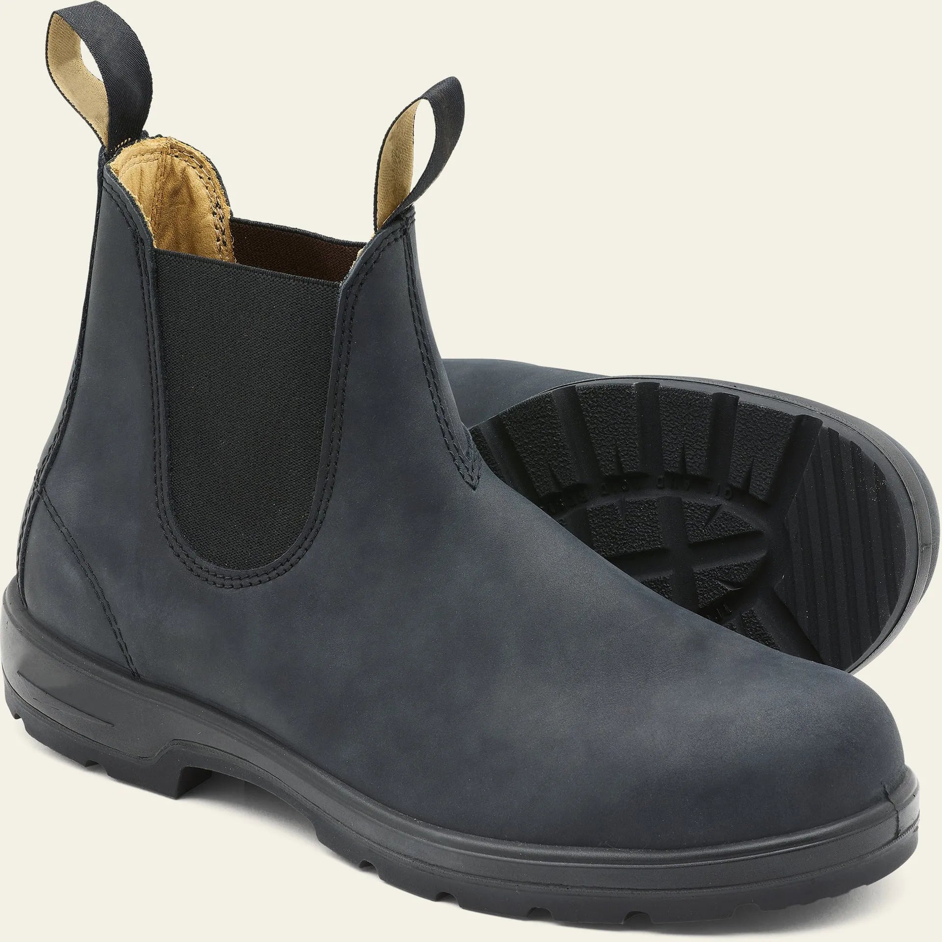 Vintage frosted brown PU leather Chelsea boots for men and women on a wooden surface.