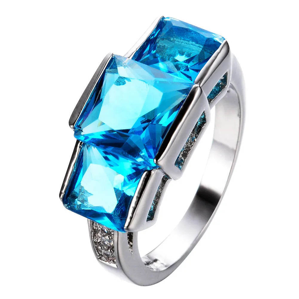 Electroplated copper women's ring ornament in various colours showing geometric rainbow design.