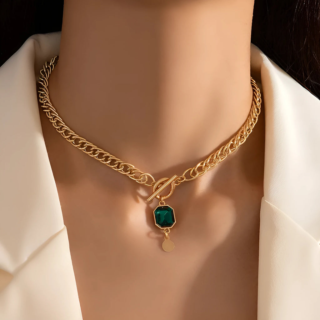 Gold electroplated pendant necklace with geometric round design on Cuban link chain