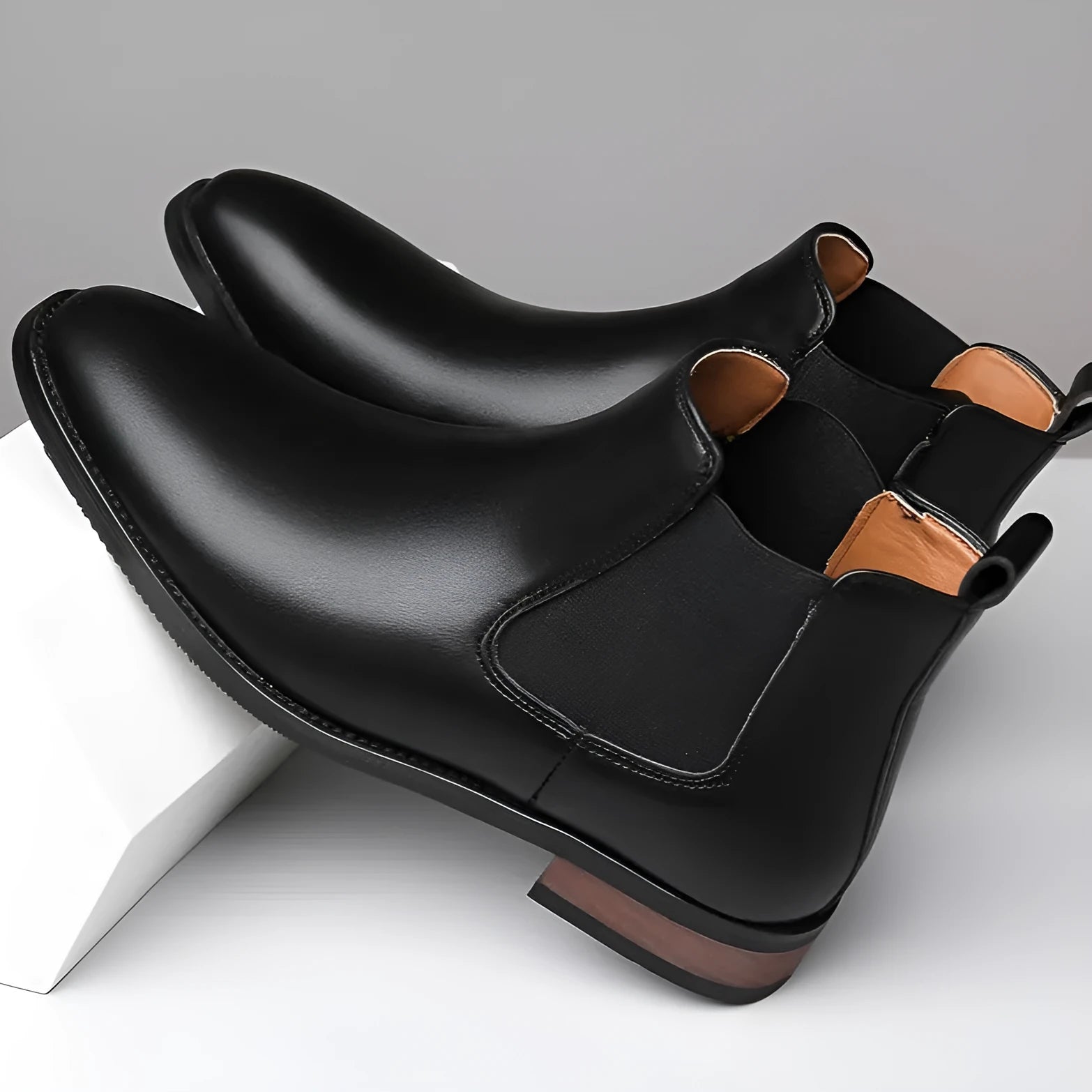Men's Chelsea boots in black and light brown with pointed toe and mid-calf height