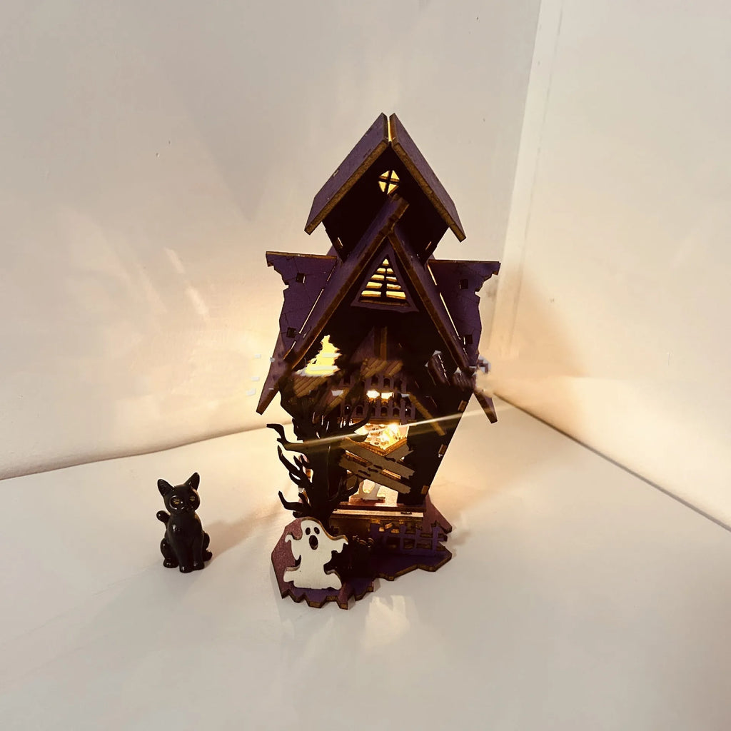 Unassembled DIY wooden haunted house Halloween decoration kit with glowing colour details.