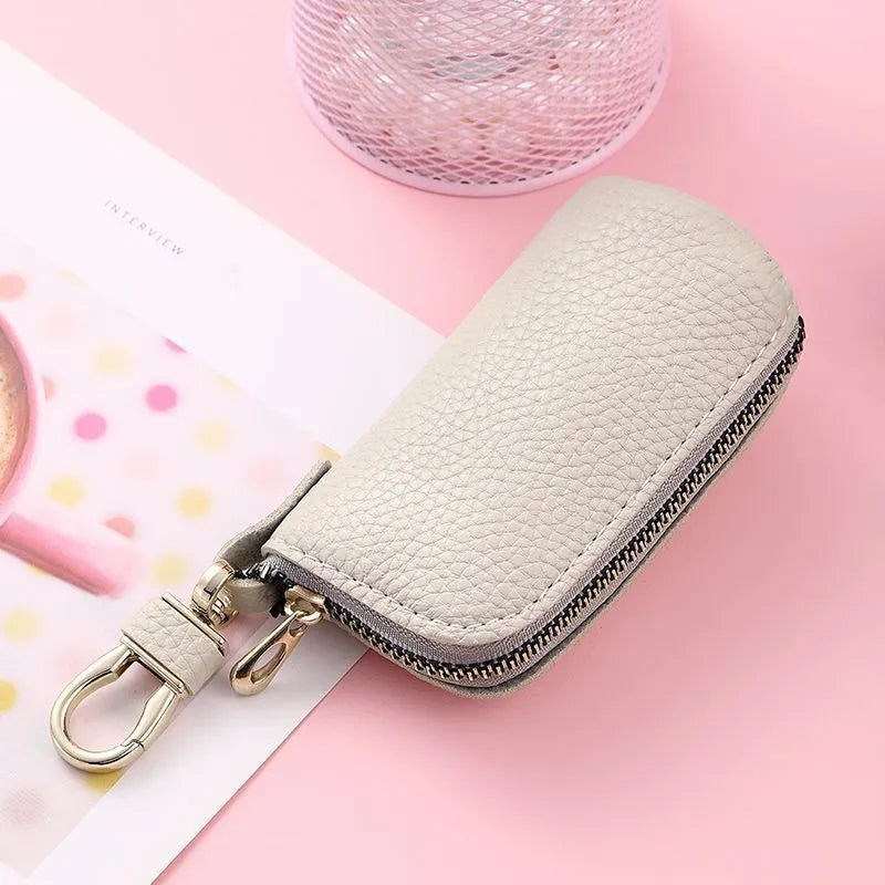 Minimalist black waterproof PU leather zip key pouch for car keys on table