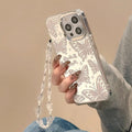 Three-in-one transparent TPU phone case with mirror, bow, and bracelet for iPhone 15 Pro Max