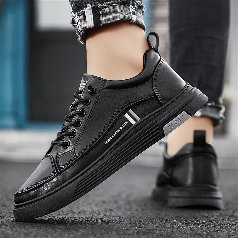 Men's white low-top skate shoes with elastic band and round toe, on a plain background.