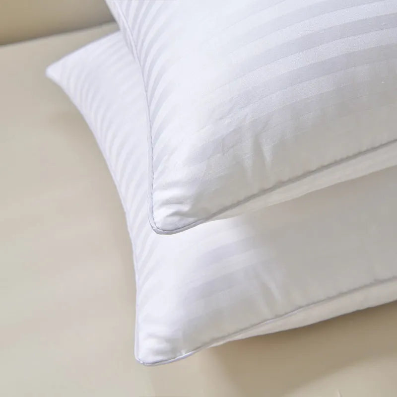 White cotton satin stripe feather pillow showing natural filling and simple styling