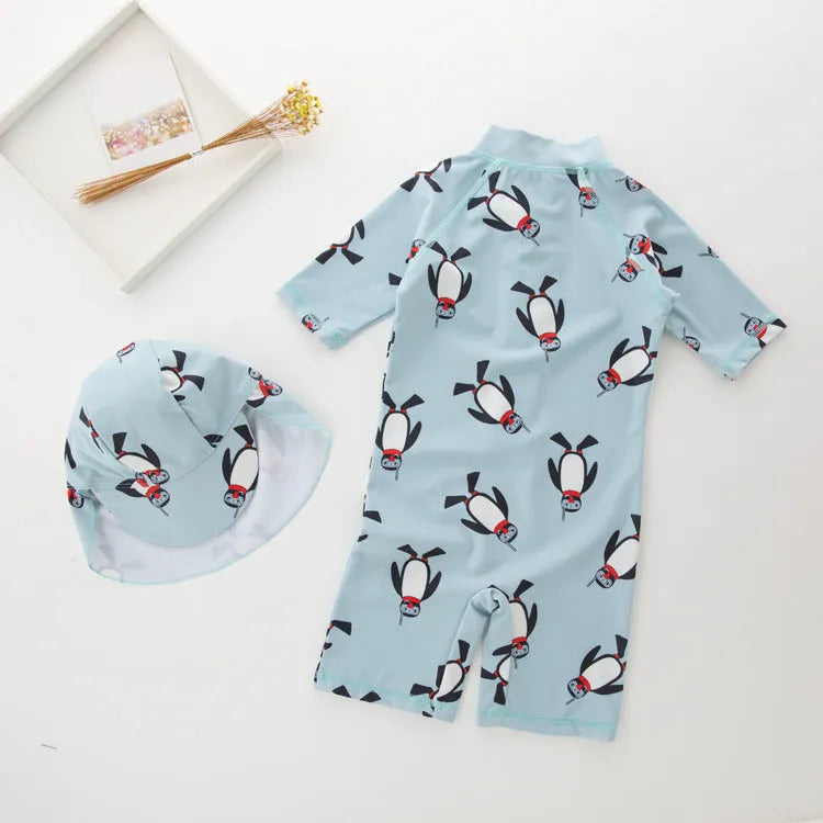 Boy's penguin print long sleeve swimsuit two-piece set with matching swimming cap