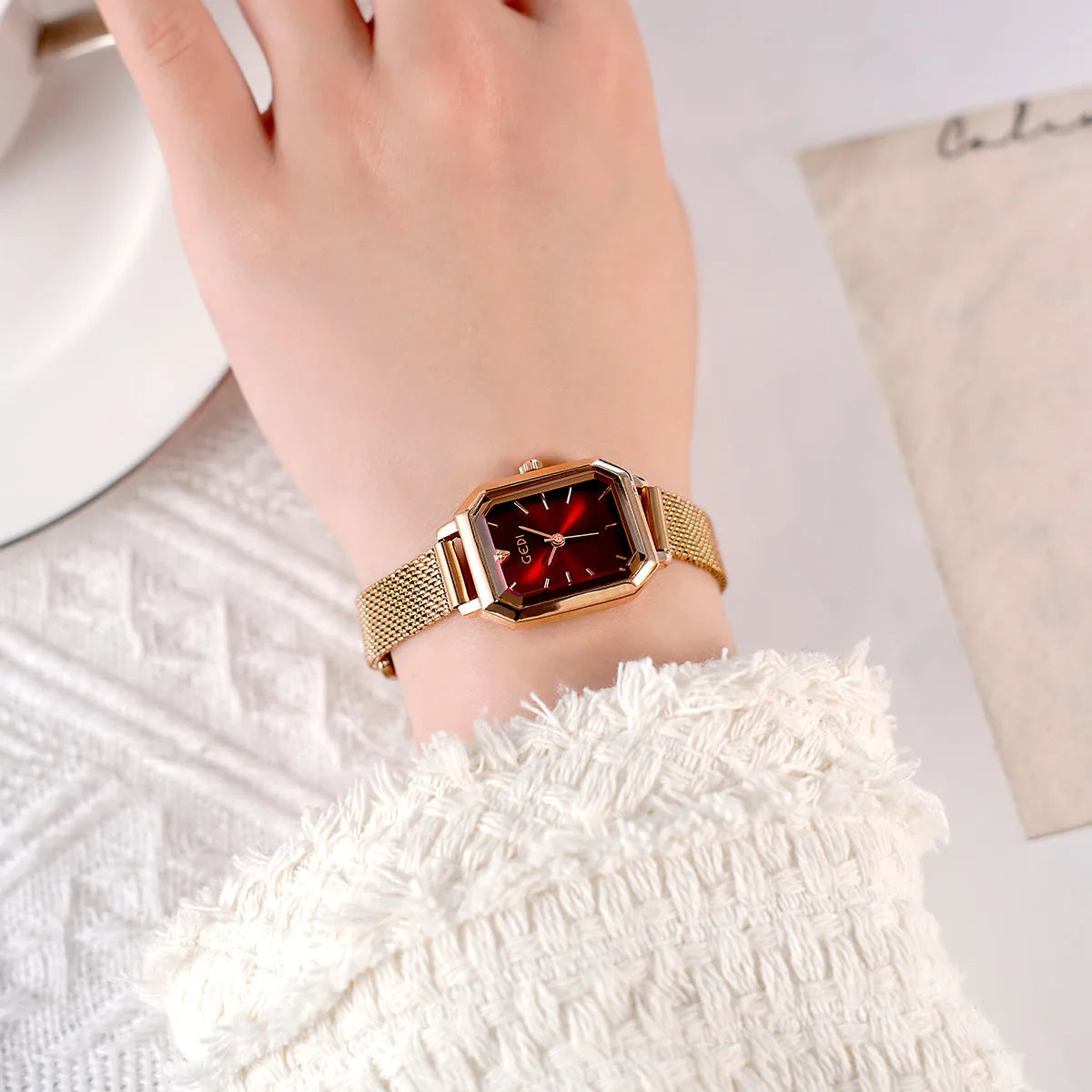 Women's casual retro square watch with rose gold shell and black dial on black strap