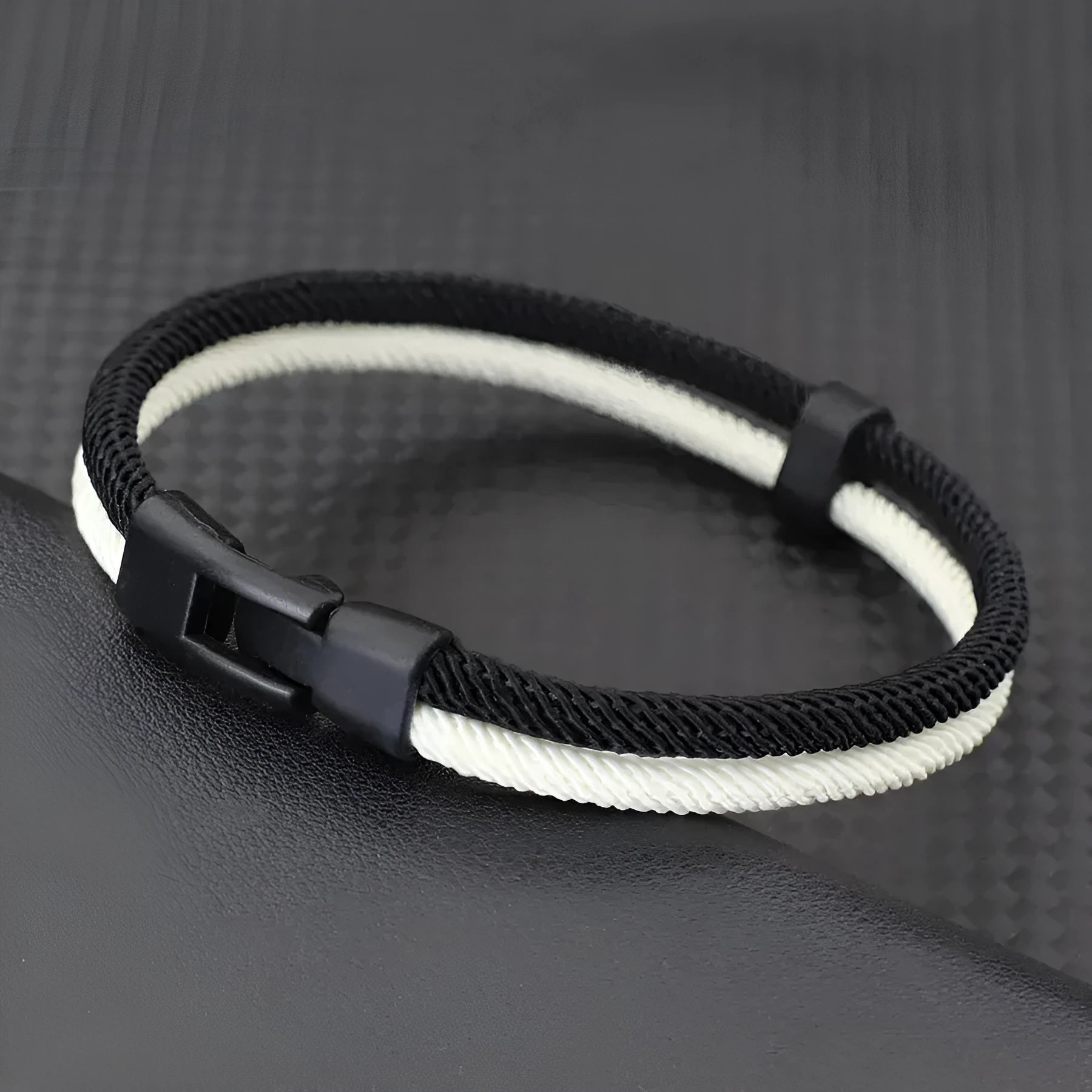 Handmade woven hand strap in black and white colours with Milan rope alloy construction