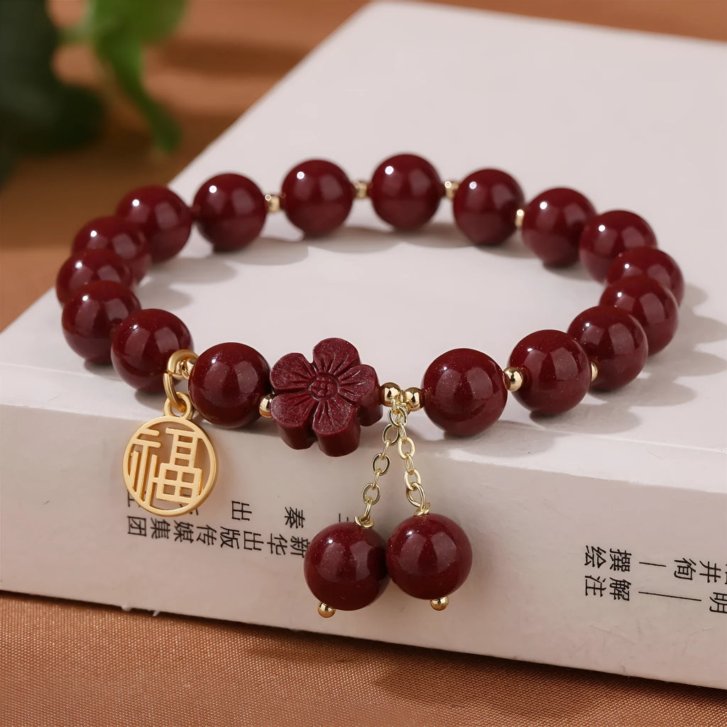 Women's cinnabar national style bracelet with purple gold sand finish and Fu character peach blossom charm