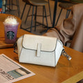 Women's brown oil wax leather messenger bag with crossbody strap and interior compartments