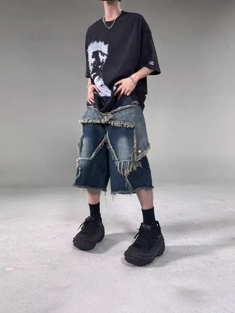 Blue denim shorts with frayed five-pointed star design and loose fit
