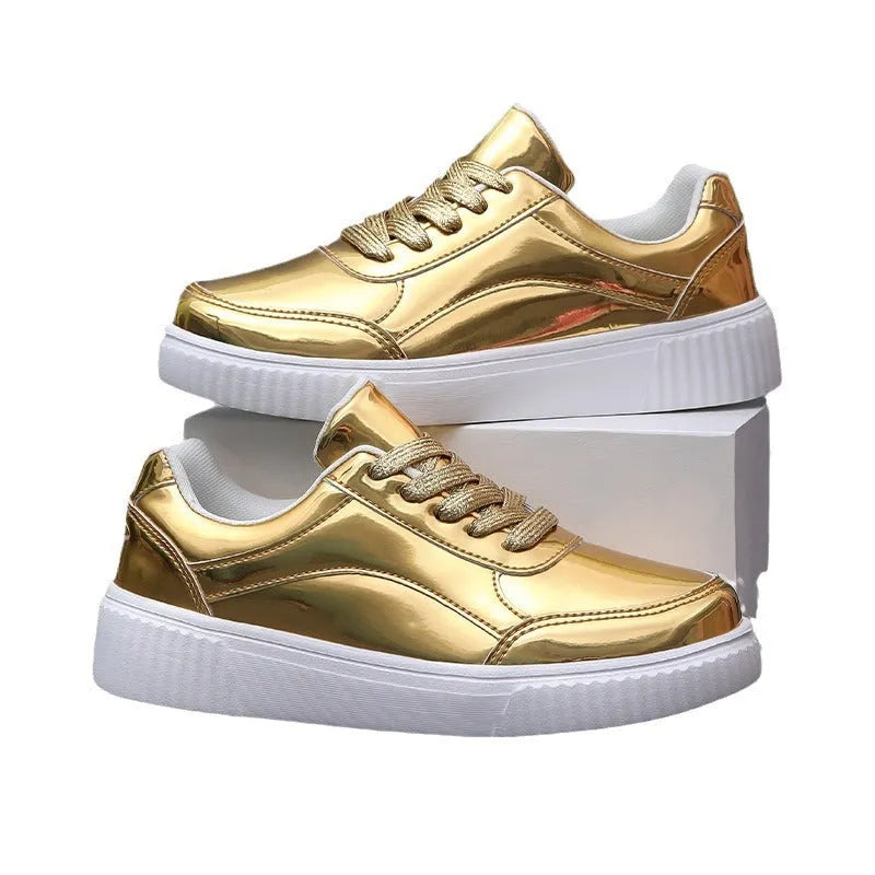 Gold sequinned platform sneakers with a round toe and a thick MD sole.
